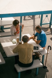 a group of people sitting at a table