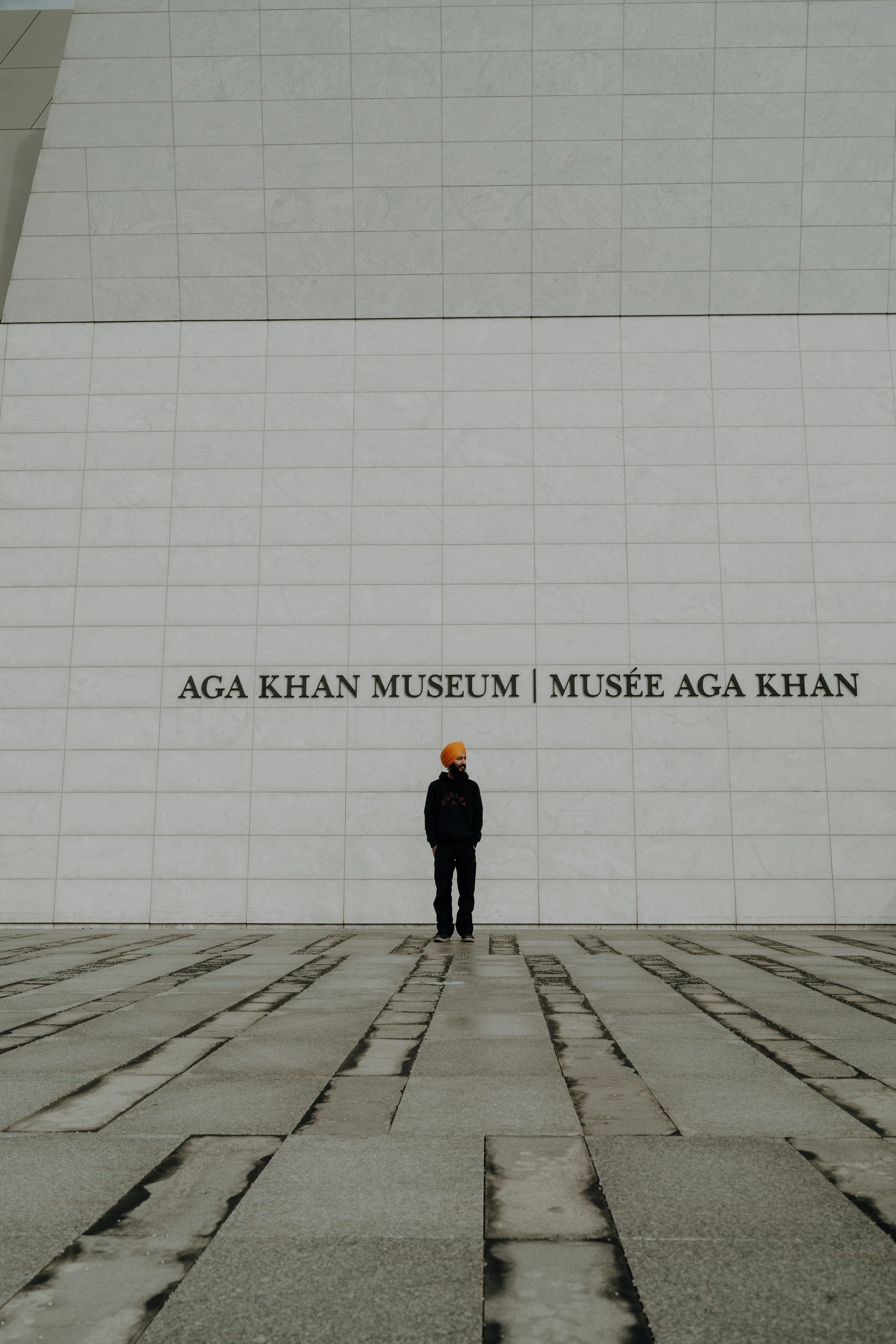 Person standing in front of a building