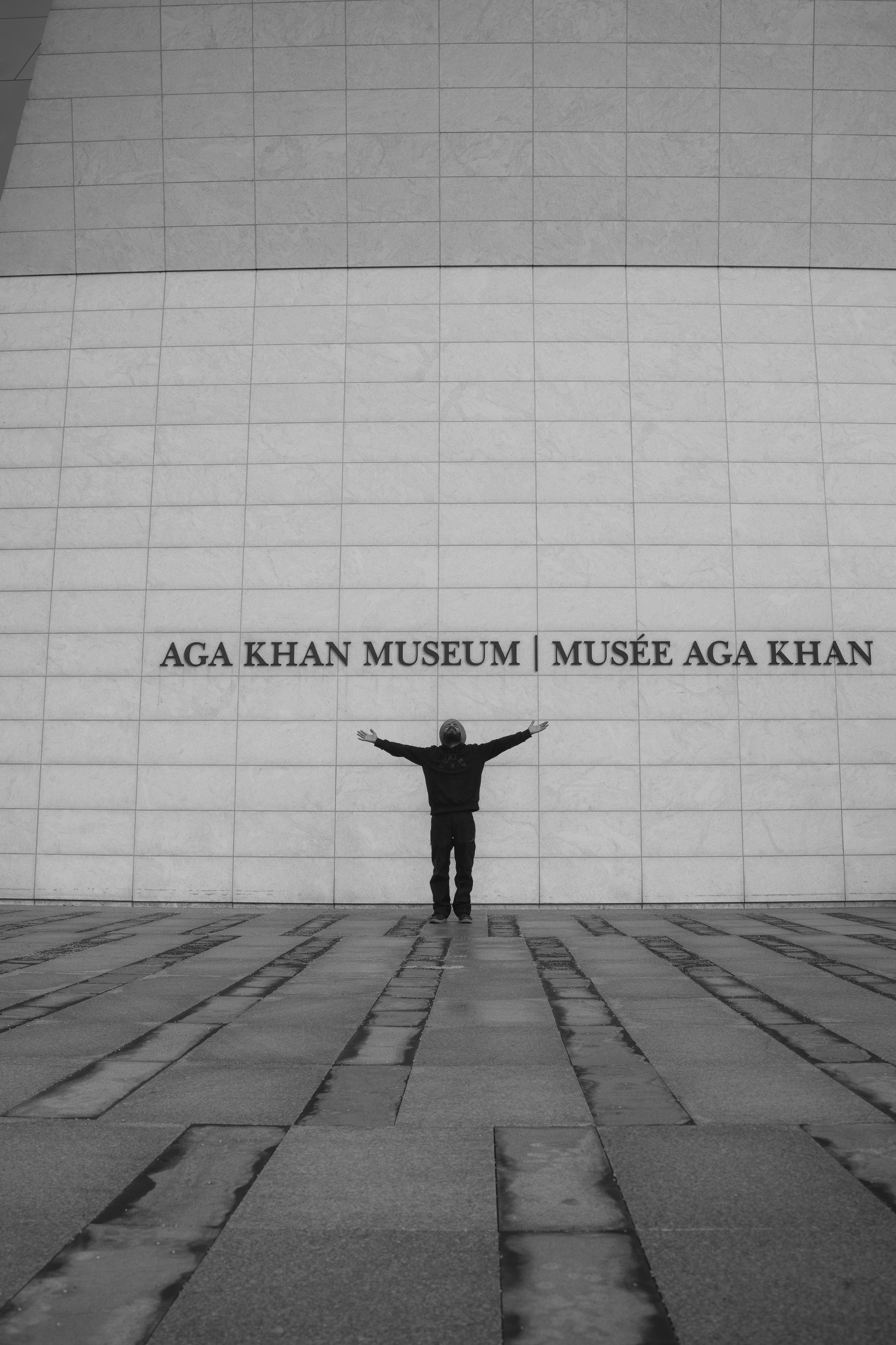 Person standing in front of a building