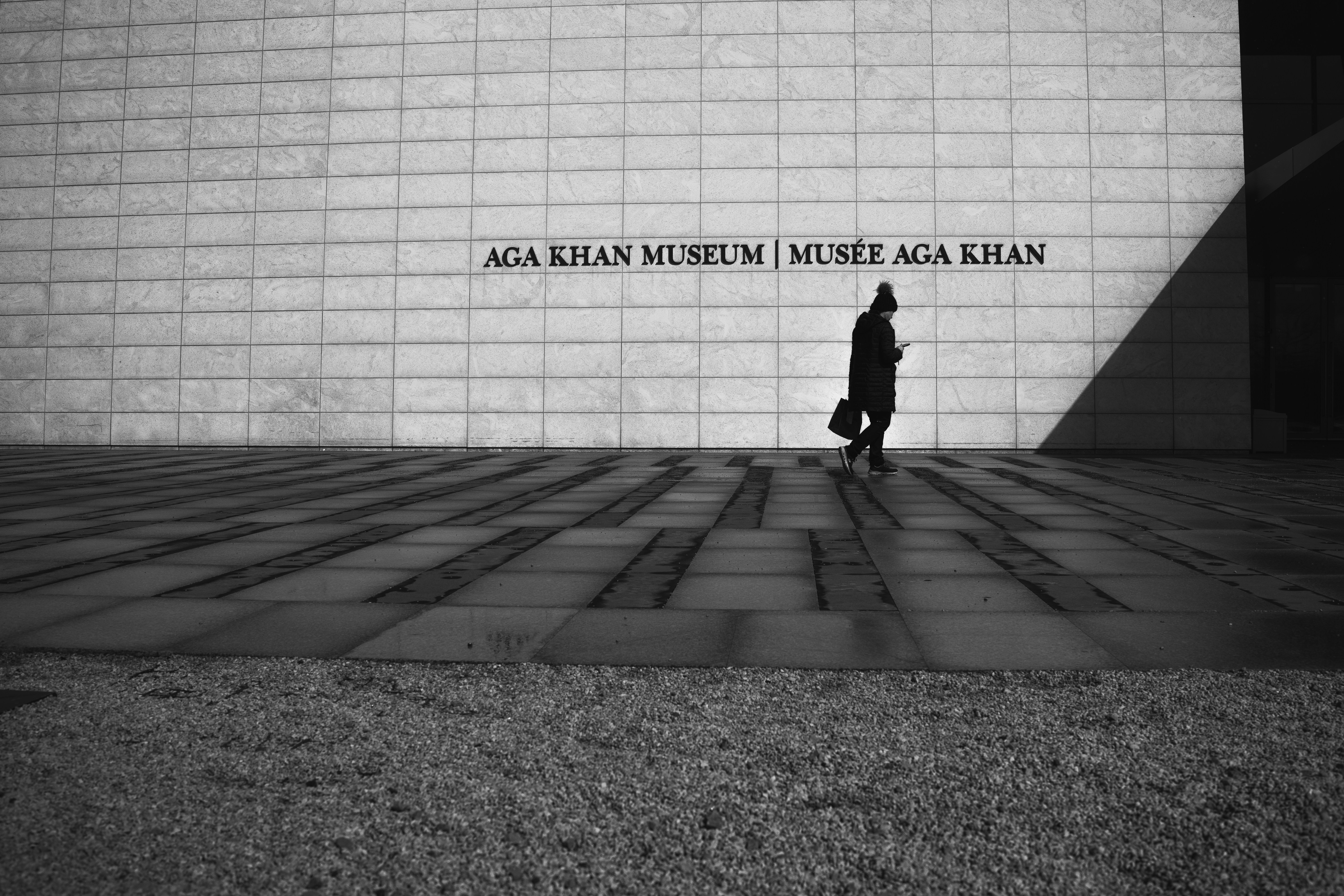 a person walking in front of a building