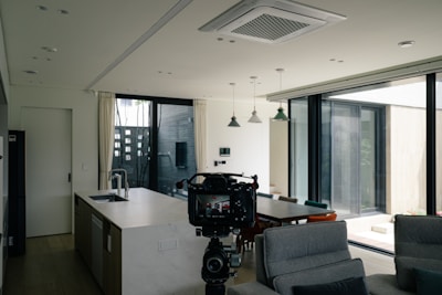 a camera set up in front of a kitchen and living room