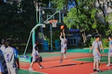 a group of young men playing a game of basketball