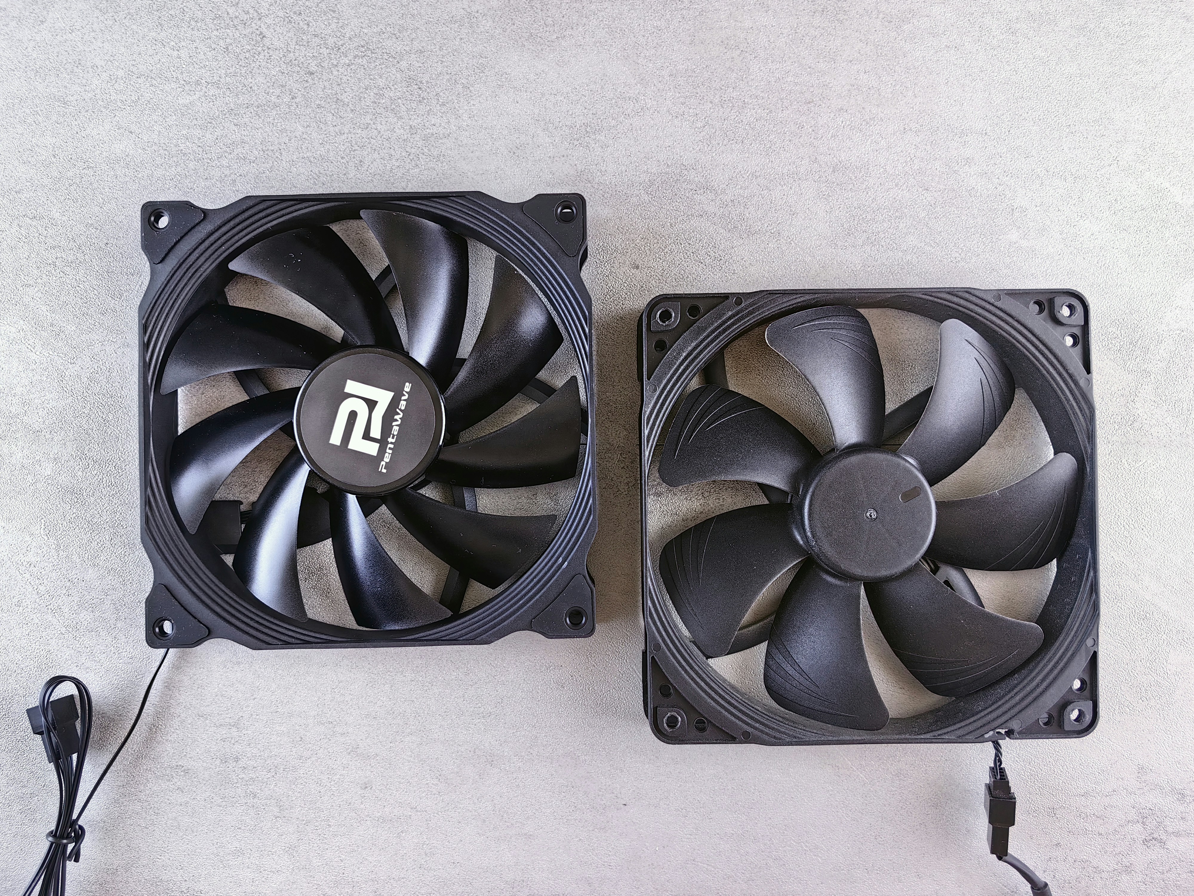 a couple of fans sitting on top of a table