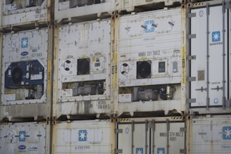a bunch of containers stacked on top of each other