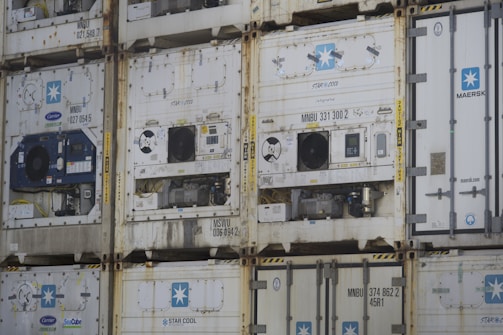 a bunch of containers stacked on top of each other