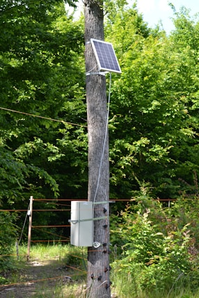 a solar panel attached to a telephone pole