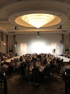 a group of people sitting at tables in a room