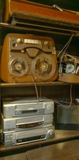 a shelf with a bunch of electronics on top of it