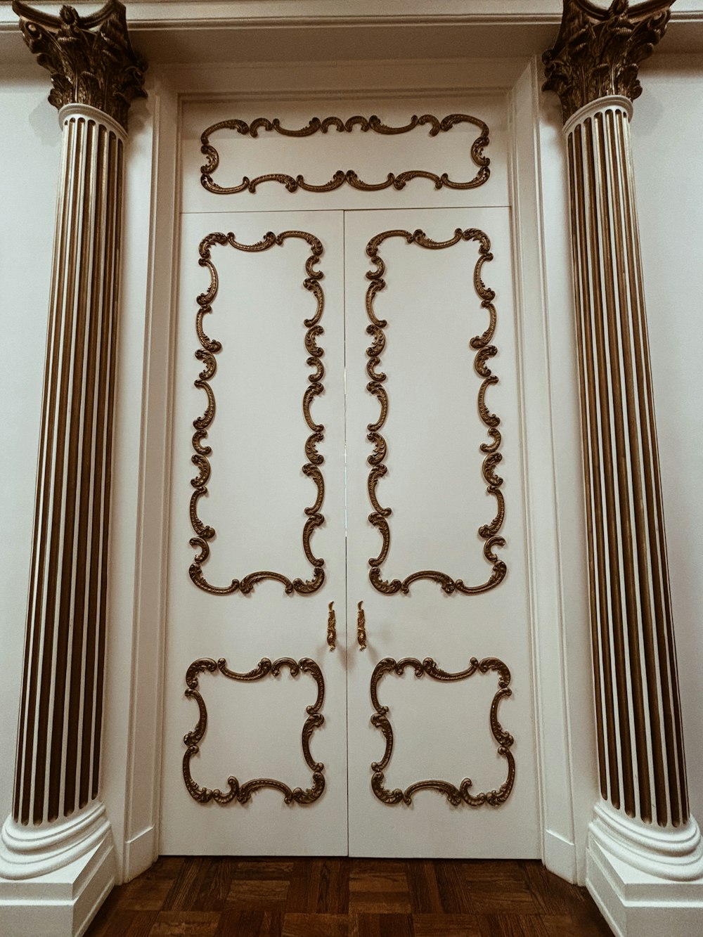 a white door with a fancy design on it