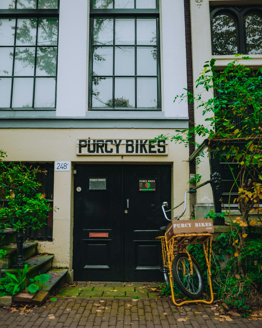 a bike is parked outside of a bike shop