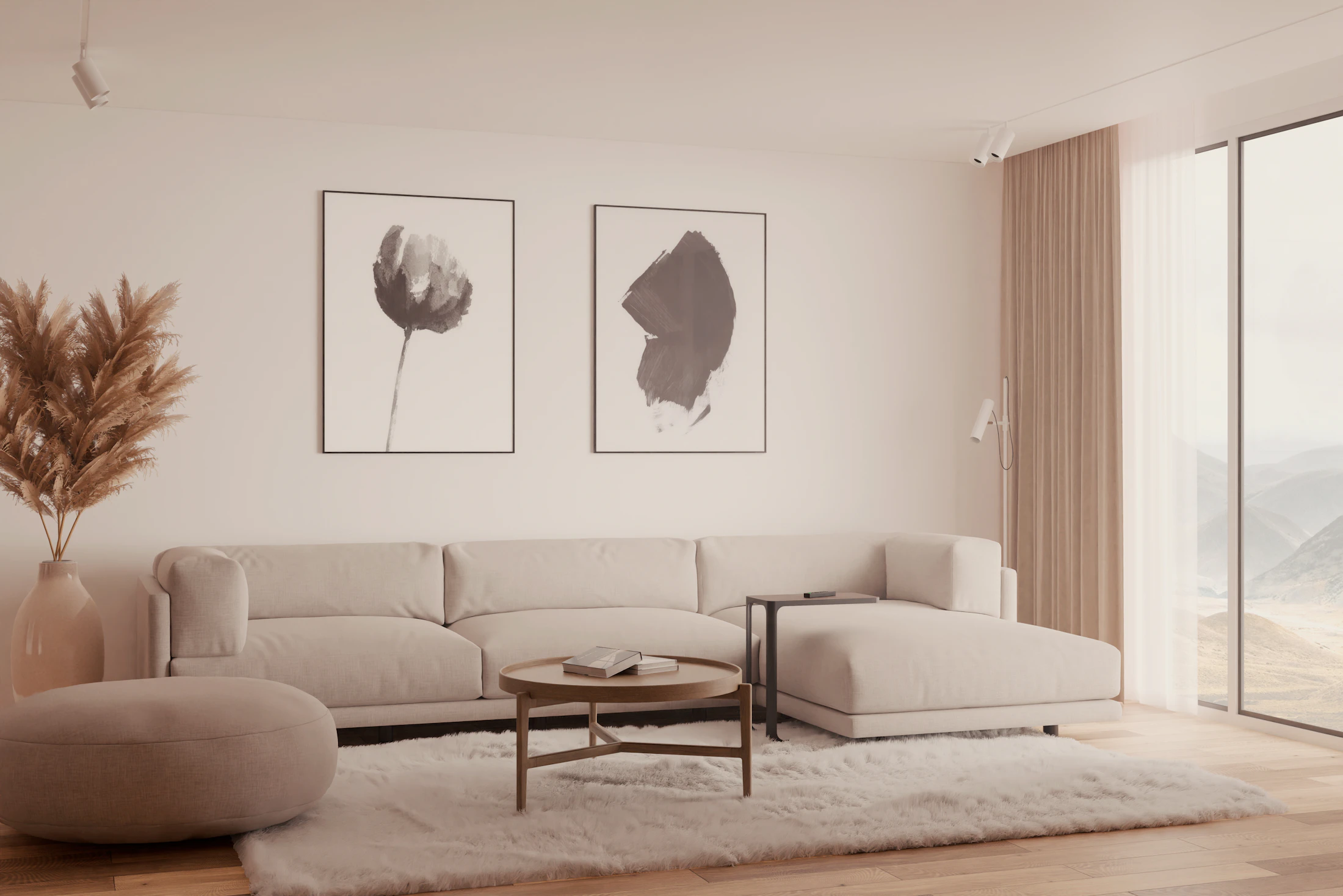 Calm living room with a long cream sofa, a rounded ottoman and two framed botanical prints