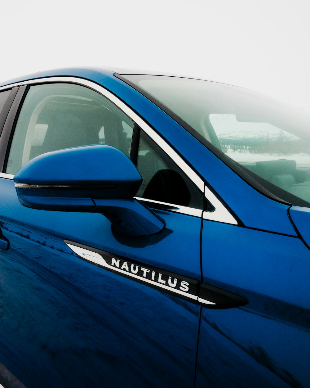 a blue car with the word nautilus painted on it