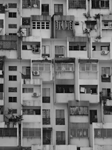 a very tall building with lots of windows and balconies