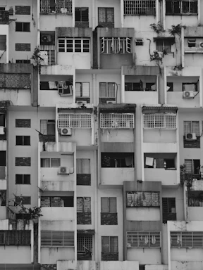 a very tall building with lots of windows and balconies