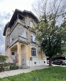 a house with a tree in front of it