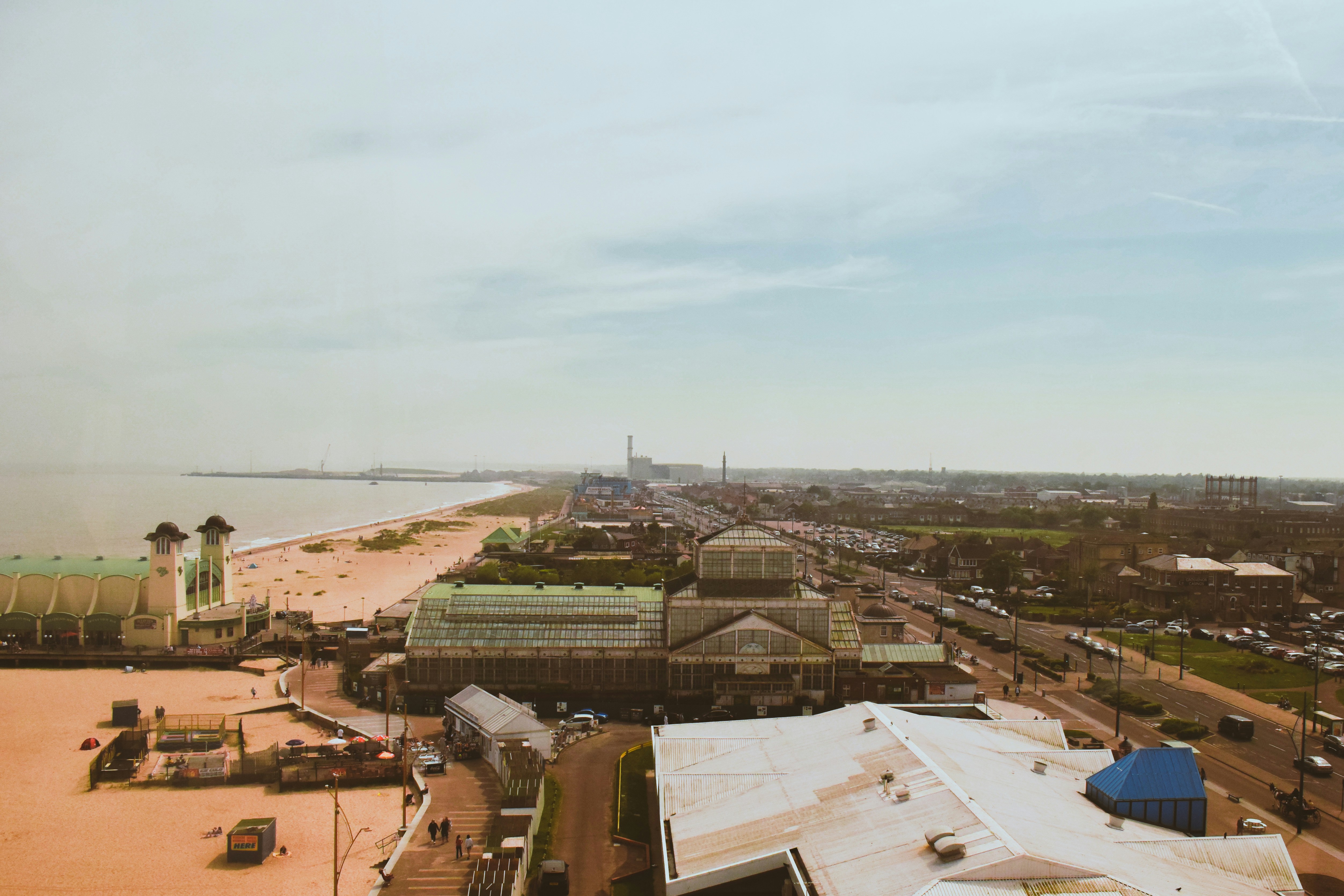an aerial view of a beach and a city