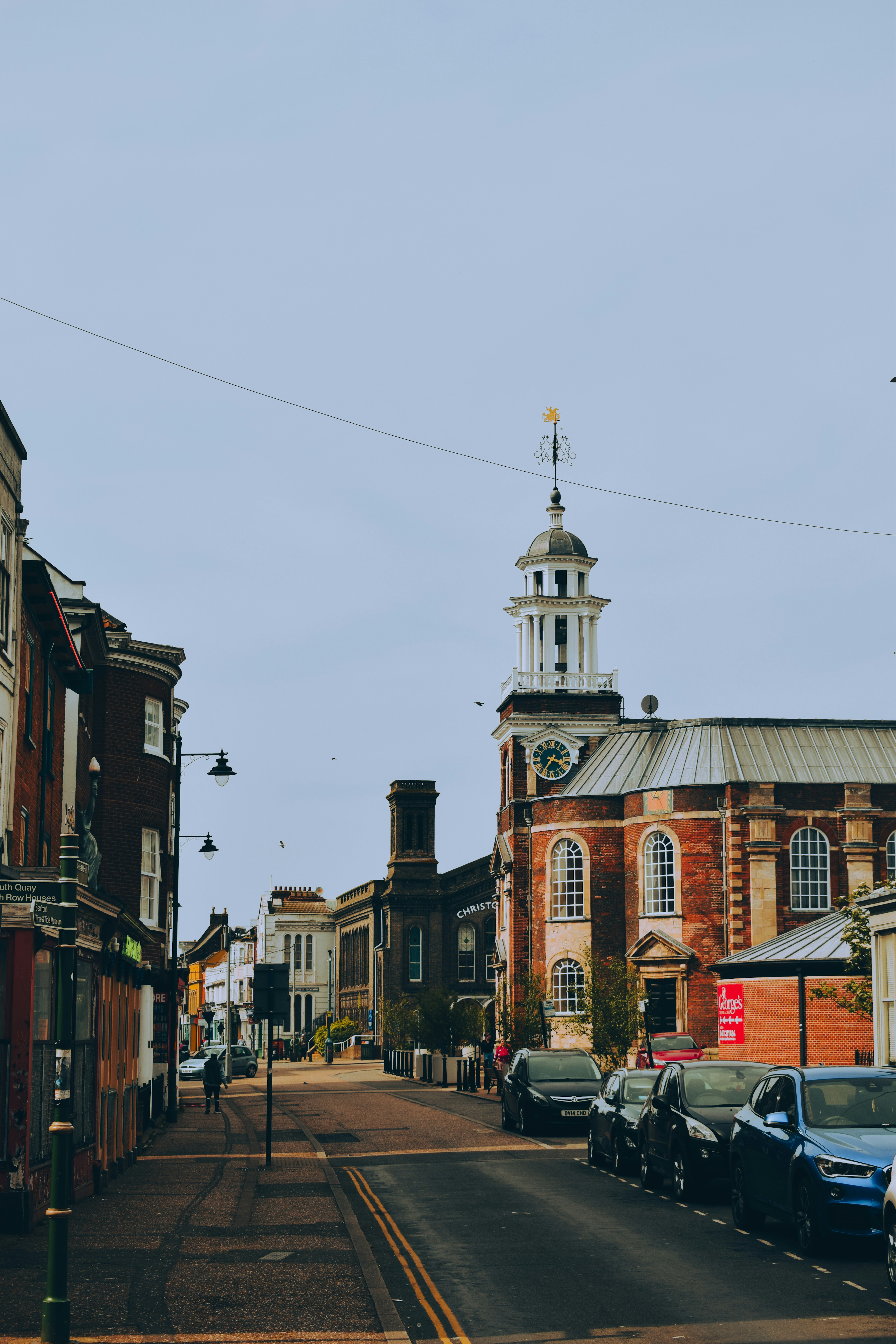 a street with cars parked on the side of it