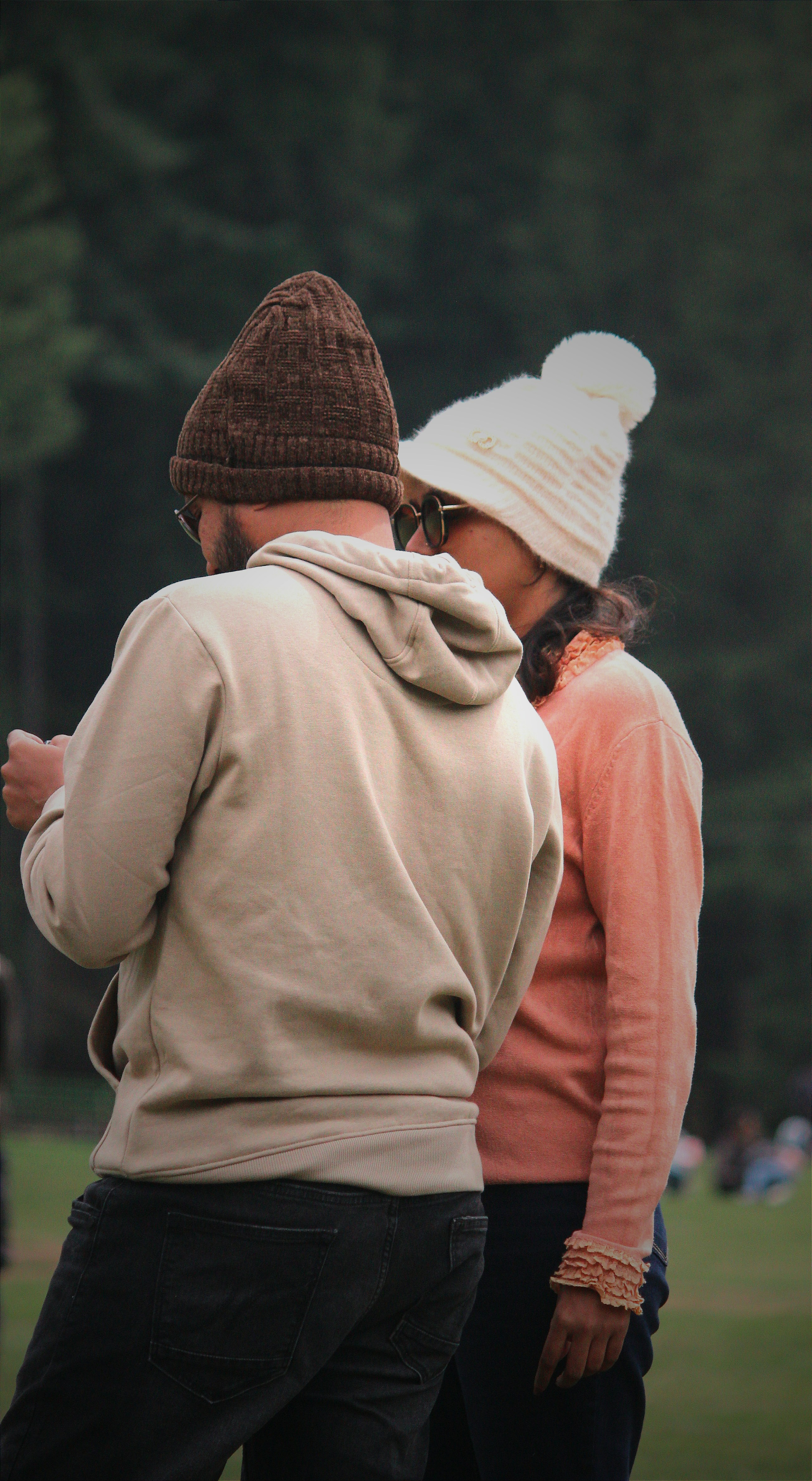 a couple of people standing next to each other