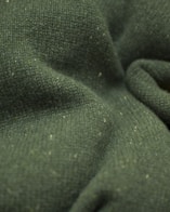 a close up view of a green fabric