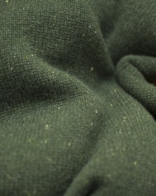 a close up view of a green fabric