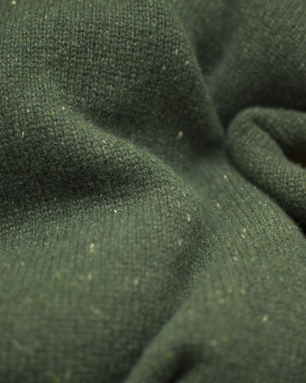 a close up view of a green fabric