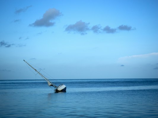 A sailboat sitting in the middle of the ocean — Key West, United States