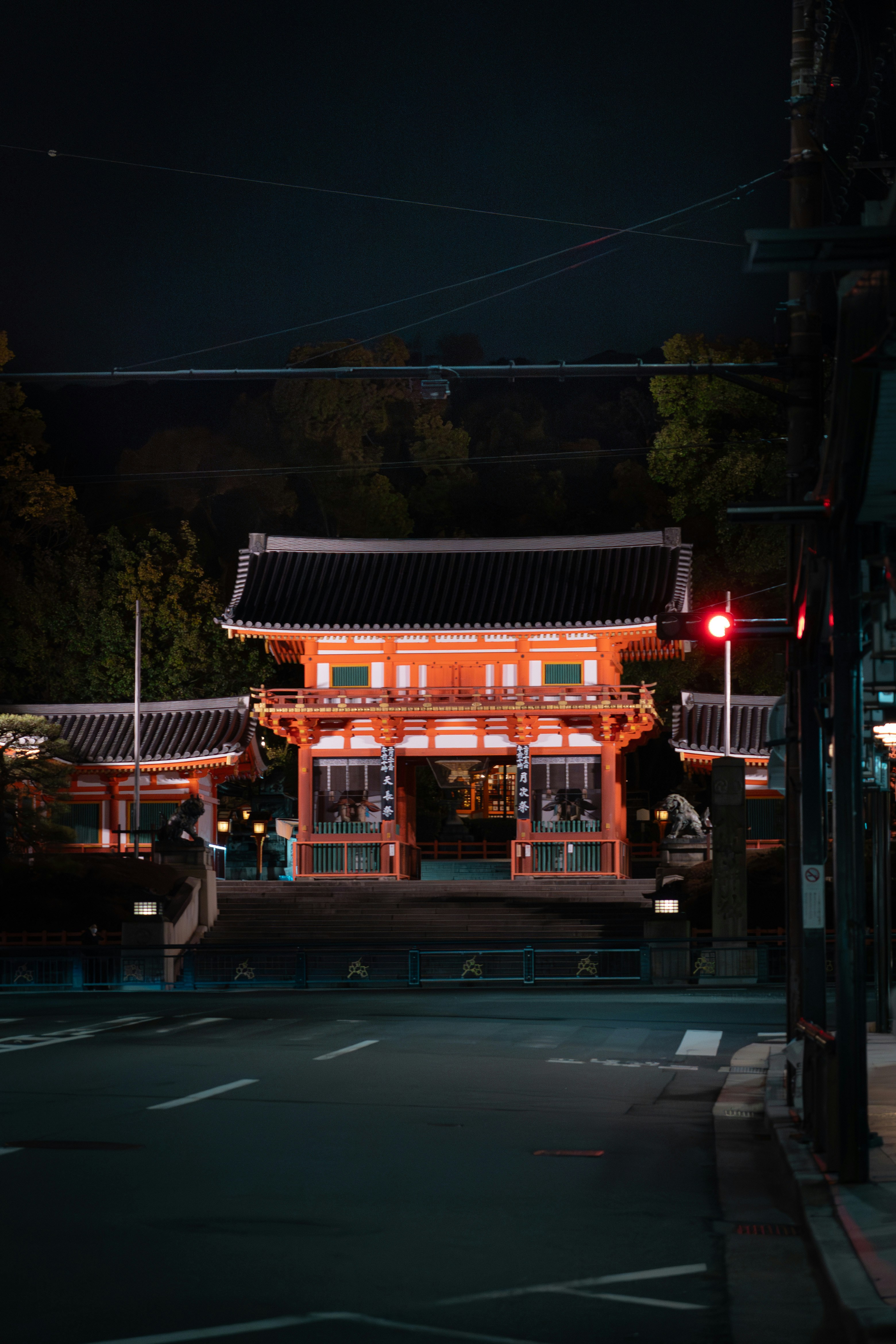 a person standing in front of a building at night