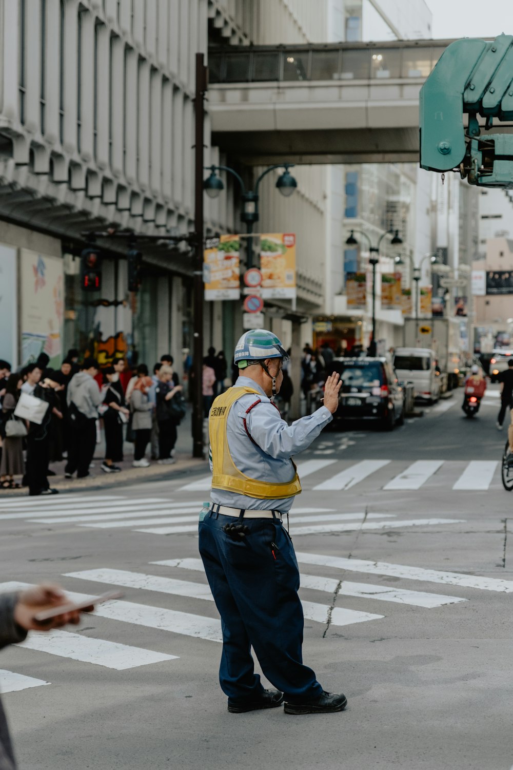 a police officer directing traffic on a busy city street