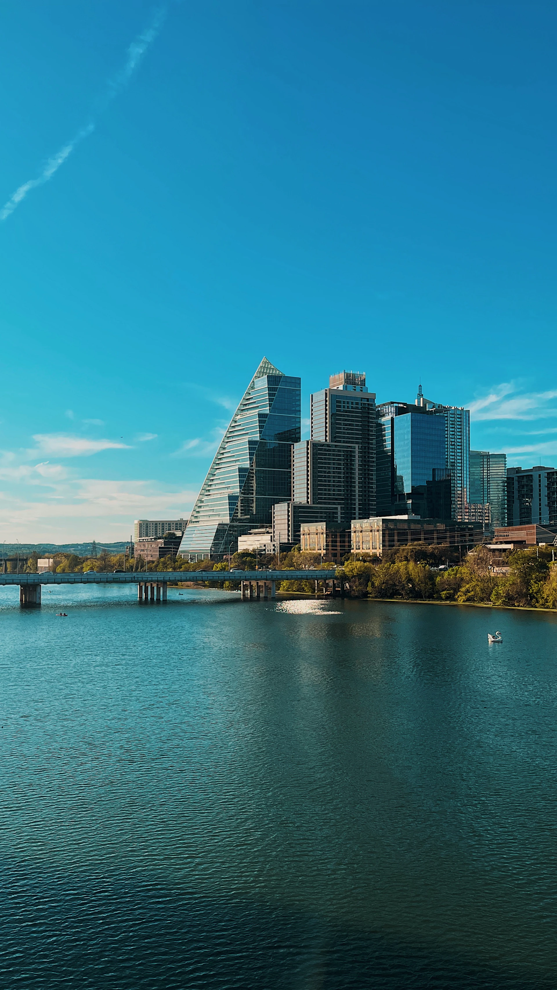 a large body of water with a city in the background