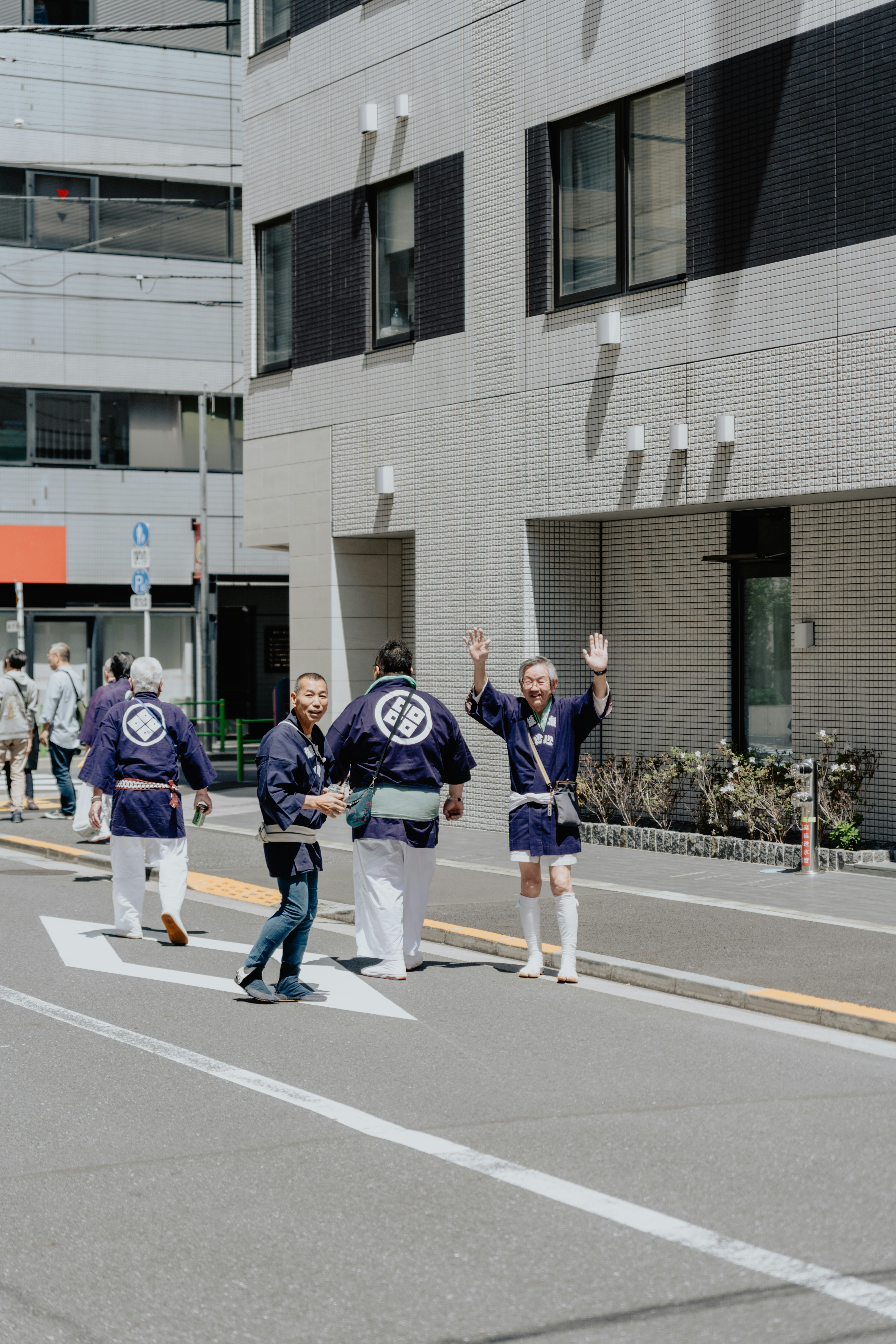 a group of people walking down a street