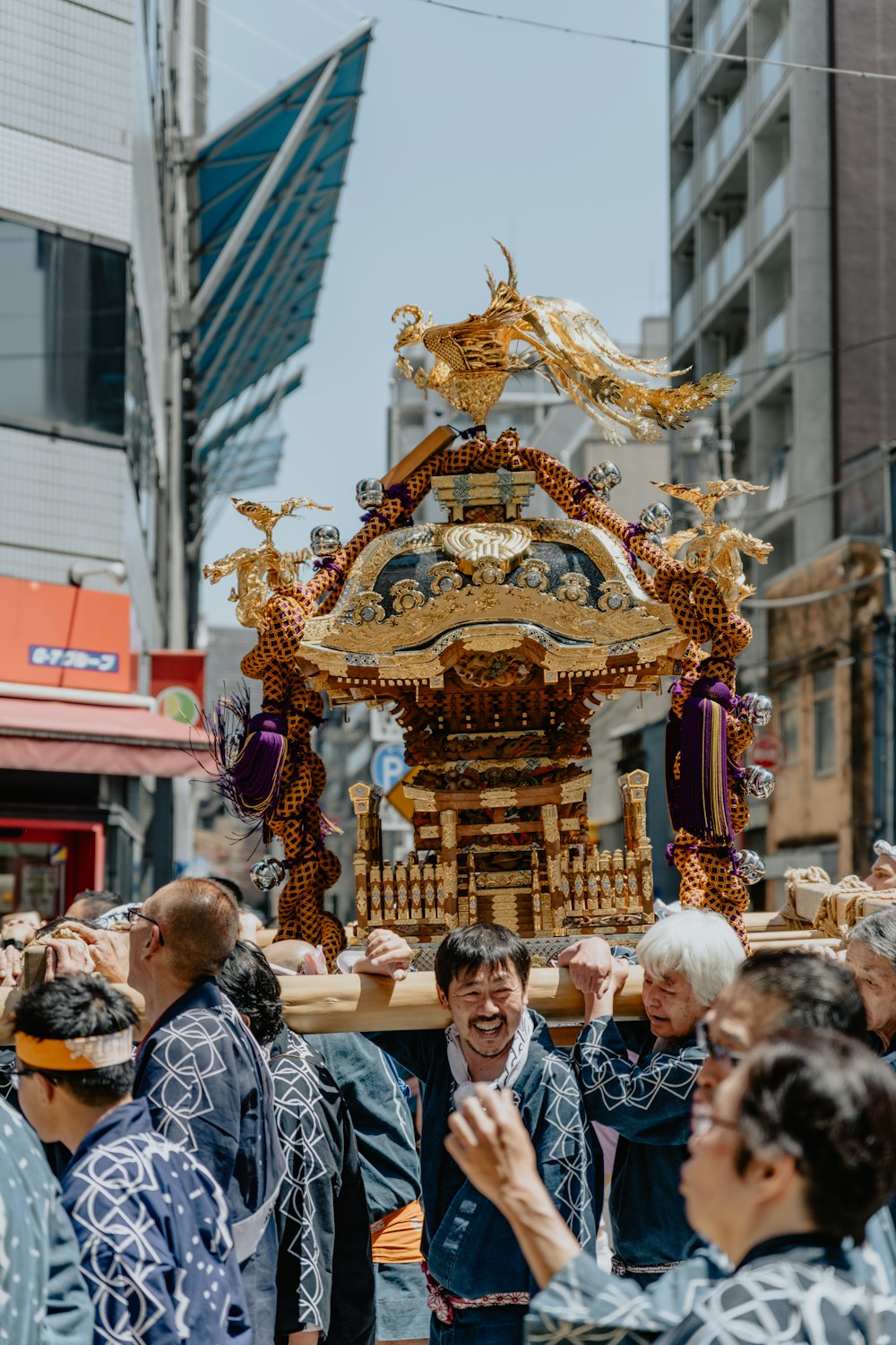 a group of people standing around a float in the street