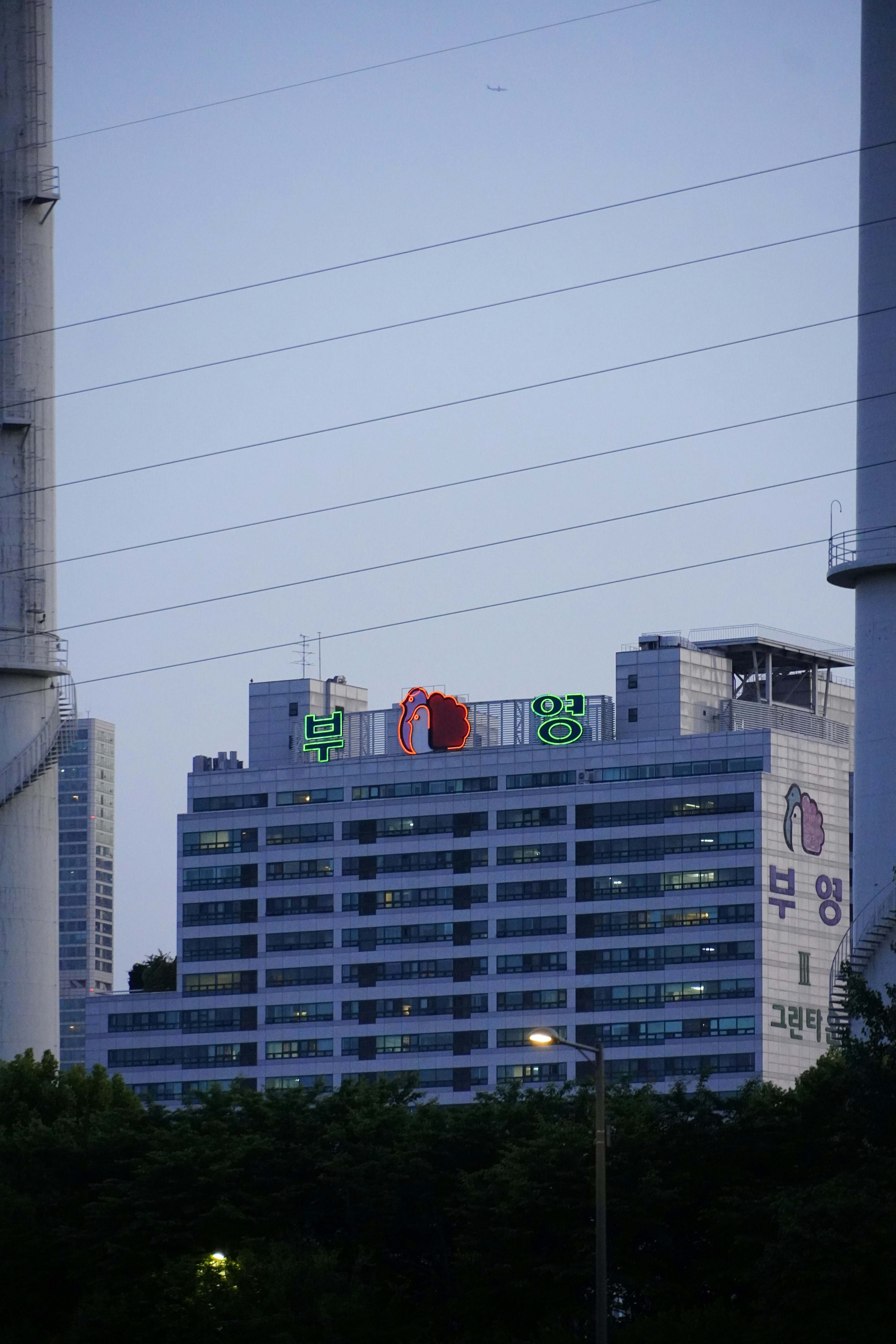 a tall building with a sign on top of it