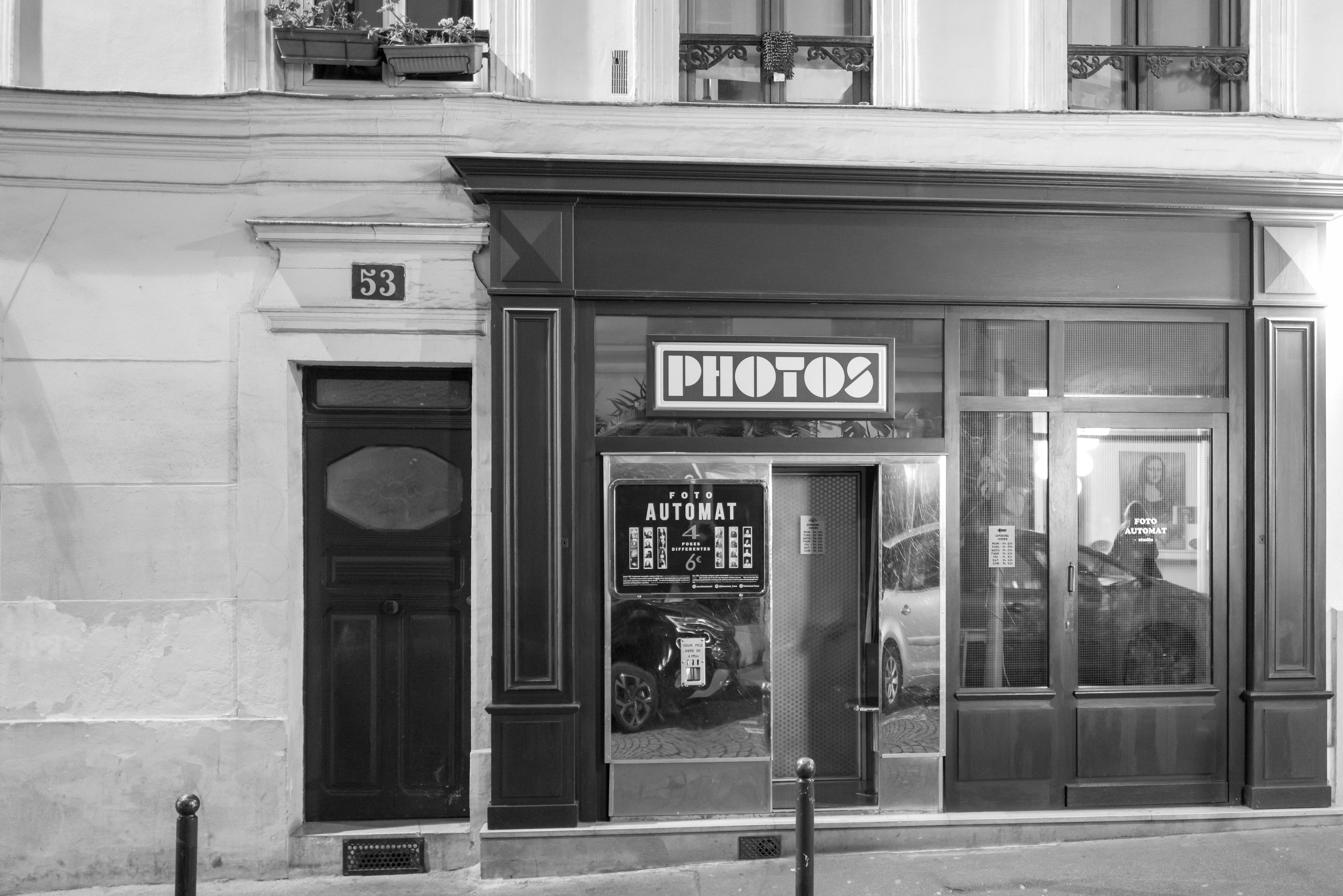 a black and white photo of a store front