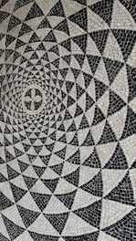a black and white photo of a circular design