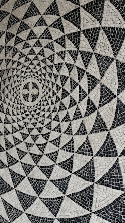 a black and white photo of a circular design
