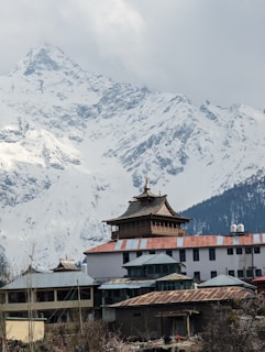 a building with a mountain in the background