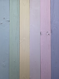a close up of a multi colored wooden wall
