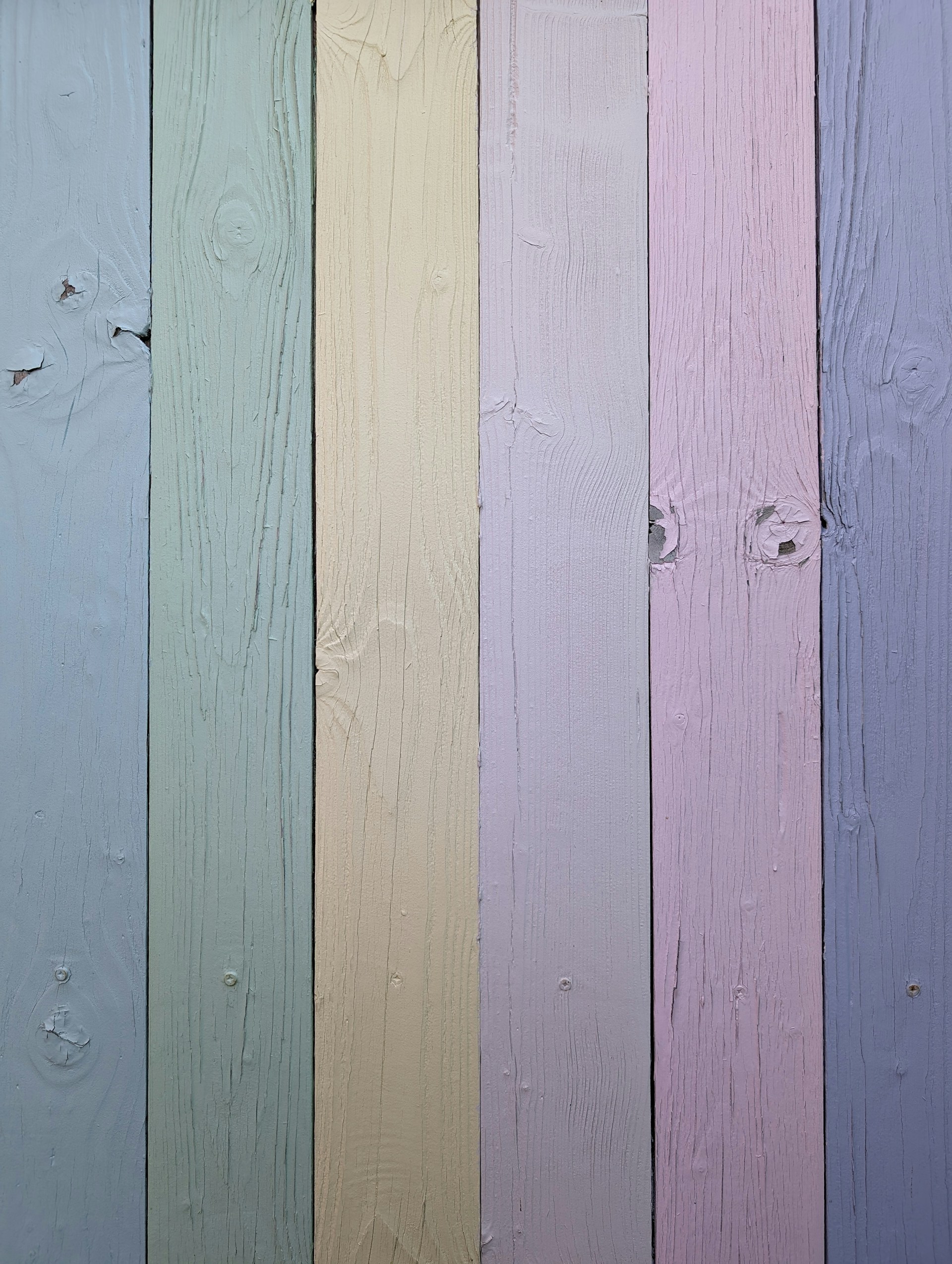 a close up of a multi colored wooden wall