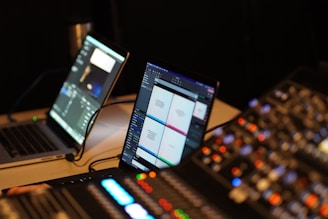 a laptop computer sitting on top of a desk