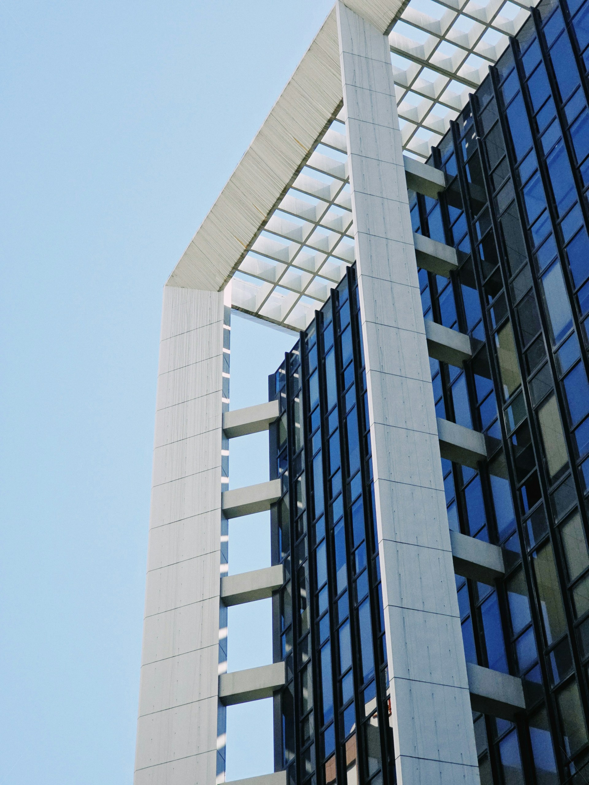 a clock on the side of a tall building