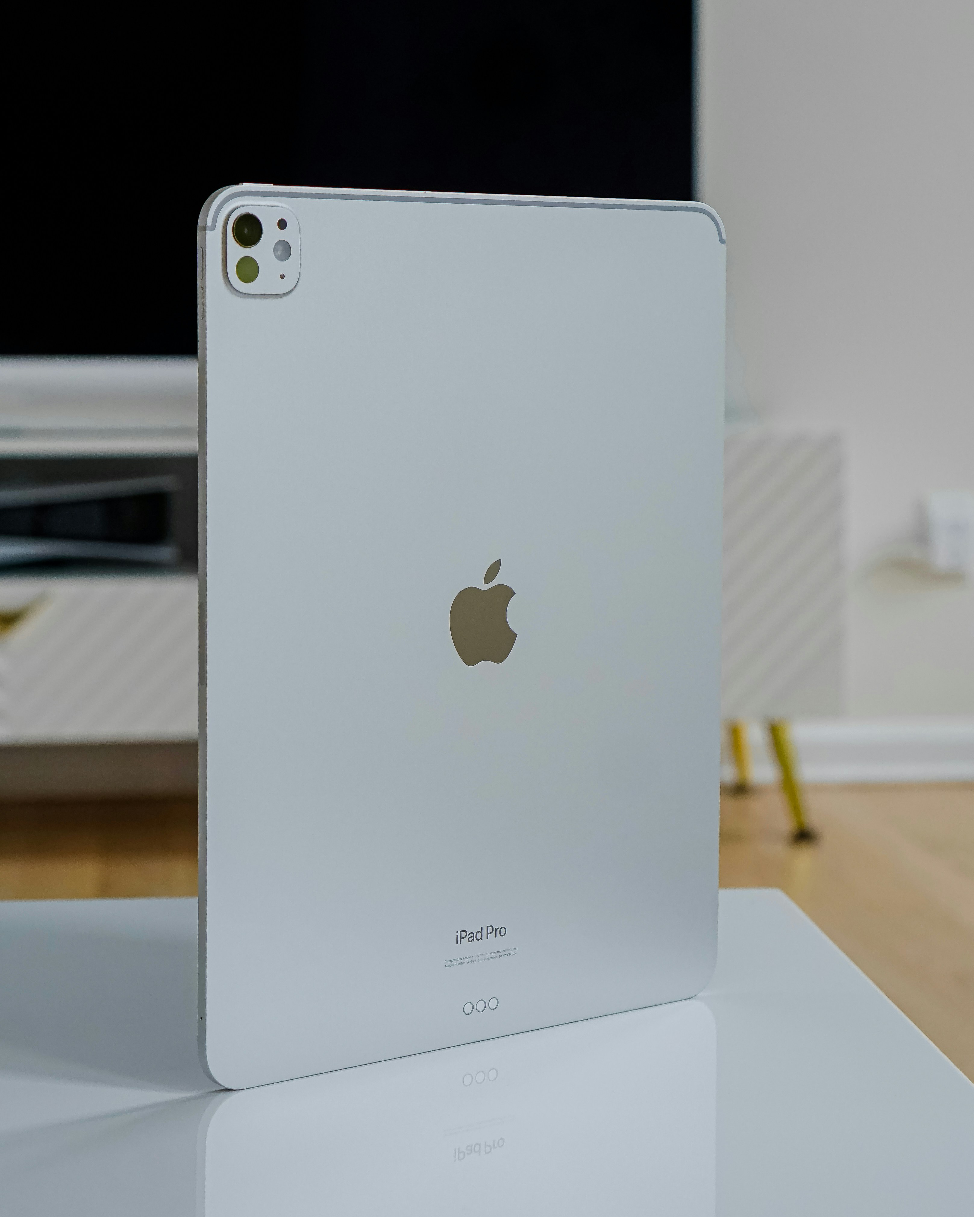 Apple iPad Pro on white background, thin profile view