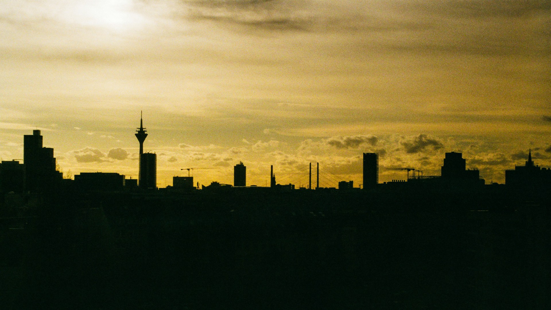 a view of a city skyline at sunset