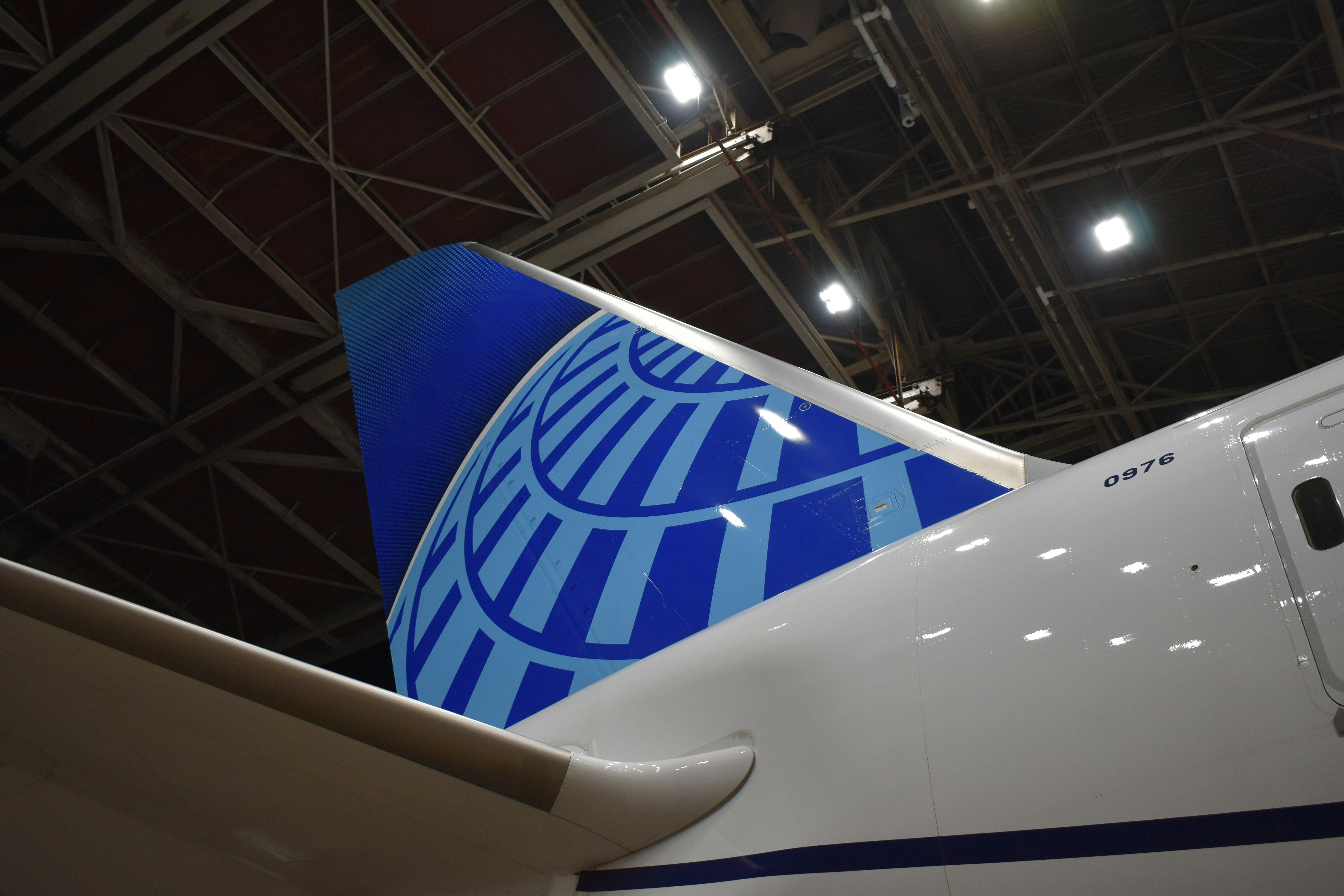 a close up of the tail end of an airplane, United Airlines 787 at a hangar at Chicago O