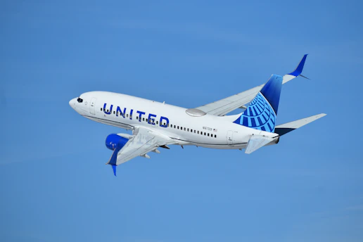 a united airlines plane flying in the sky