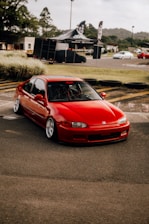 a red car parked in a parking lot