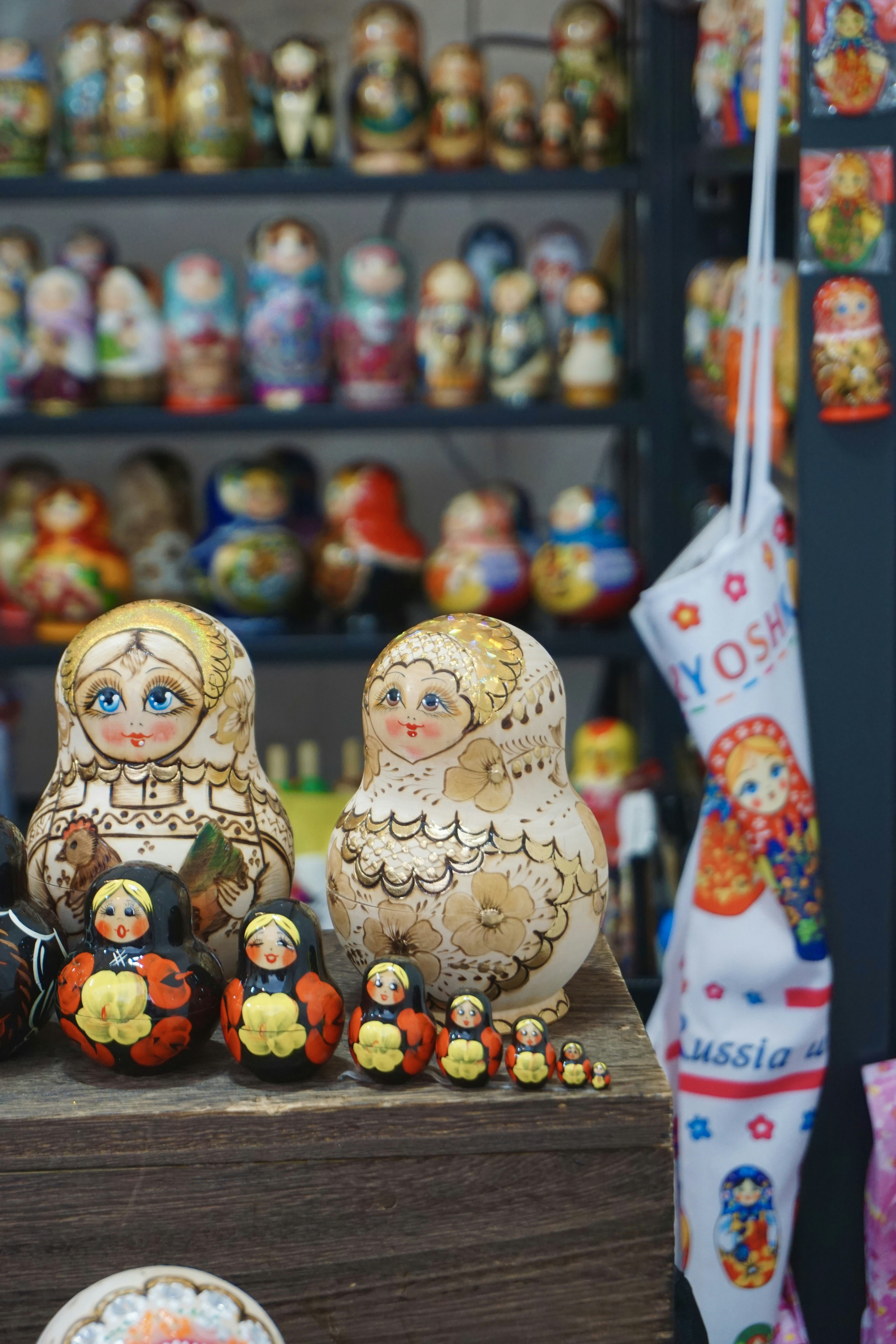 a group of wooden dolls sitting on top of a table