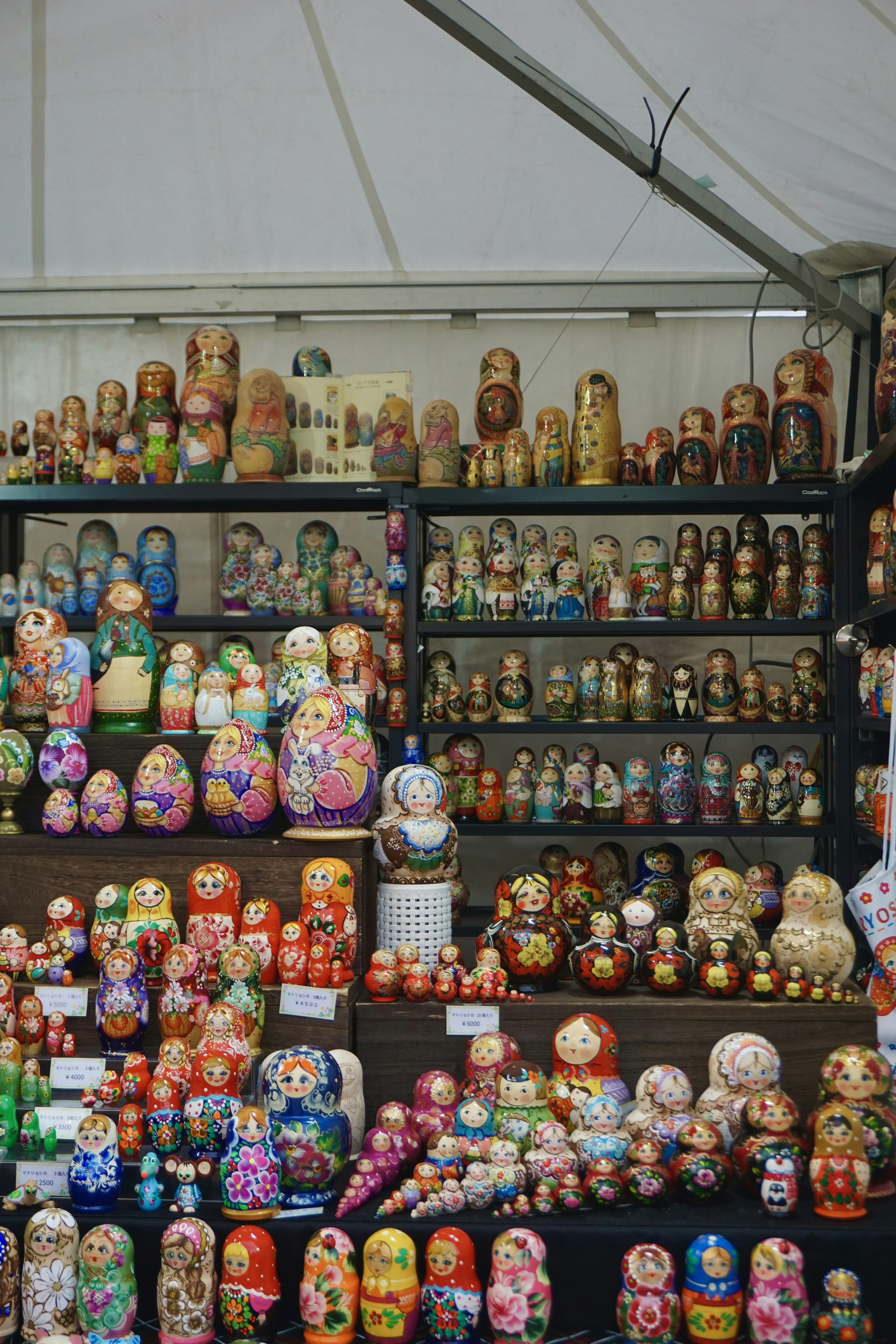 a large display of colorfully painted dolls and figurines