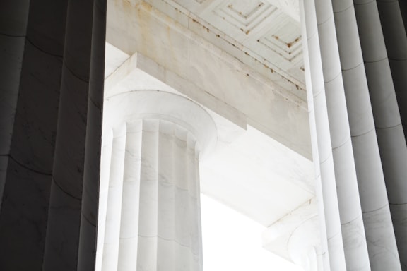 a close up of a column with a sky in the background