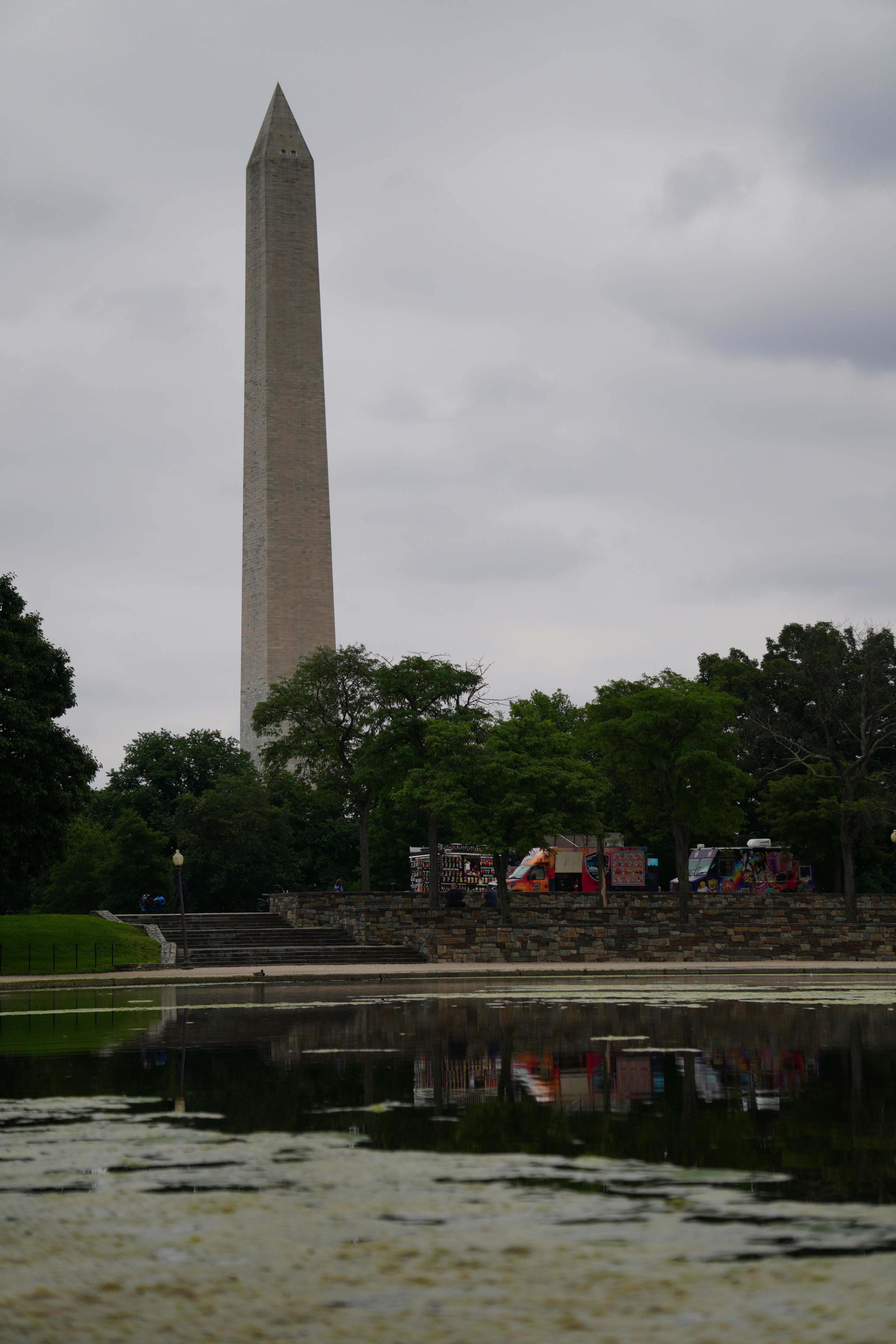 the washington monument is reflected in the water