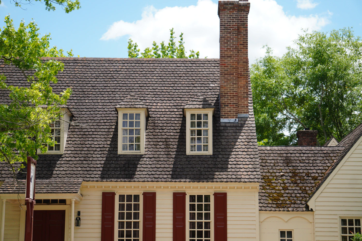 Close-up of new architectural shingles being installed